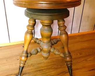 vintage piano stool with glass claw feet