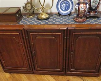 This stunning solid wood credenza is inlaid with brass and of very high quality
