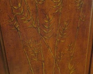 The bamboo decoration on each door of the credenza is beautifully inlaid brass.