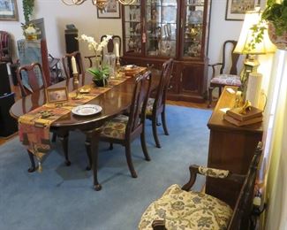 Formal dining room is packed with beautiful decor options and high-end stereo equipment.  Stunning Chippendale style dining table with (8) chairs.