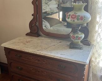 Marble top Eastlake dresser, has stained marble.  Matching commode available. 