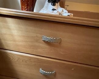 Close up of drawer handles on dresser