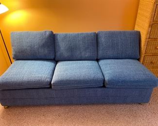 Blue sofa opens to a queen bed
