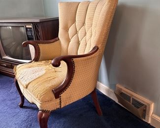 Mahogany tufted arm chair with bent arm rests and Queen Anne legs, upholstery has damage, chair is very sturdy 35"H x 25"W
