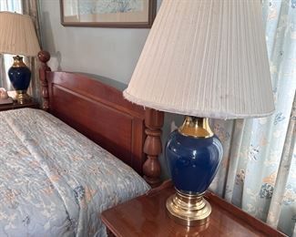Pair of blue ceramic table lamps with brass finish metal base (shades are worn) 28"H