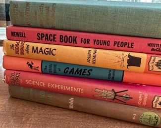 Group of books including Space Book for Young People and Real Book about Magic