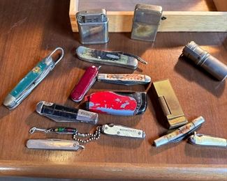 Group of vintage pocket knives and lighters