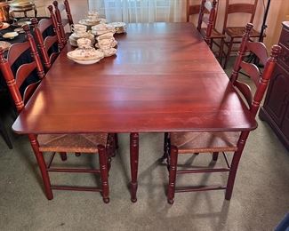 Pennsylvania House Mt. Vernon Solid Cherrywood drop-side dining table with swing leg support, 6 side chairs with rush seats, some marks to table top 72" when open, 46" wide
