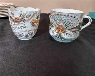 German porcelain lusterware teacups with hand painted gold accents 