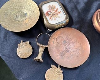 Group of brass and copper small dishes, frame, basket and magnets