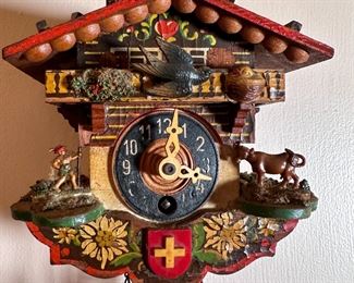 German small cuckoo clock with shield & cross front, , no key, some wear and discoloration 4"H