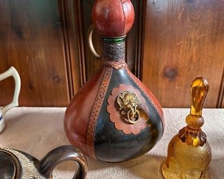 M.A. leather covered Italian wine bottle, signed (stamped) on base 10"H