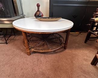 John Isner for Ficks Reed round Formica top coffee table with bamboo base, some wear overall, minor nicks to top, 16"H x 35"W