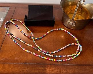 Long strand of pressed paper beads 80"