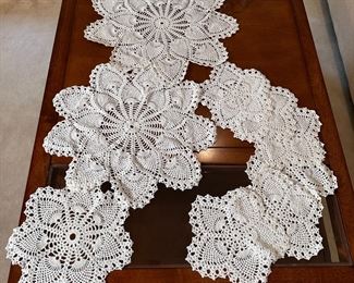 Group of crocheted flower doilies, largest is 15"