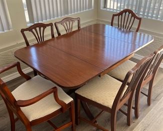 Duncan Phyfe drop leaf table with total of 6 chairs (4 are original to the set. The two end chairs are just fillers).