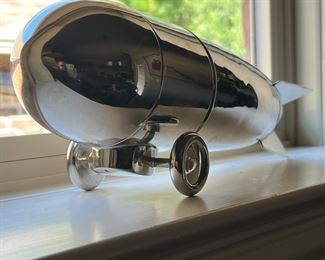 The sale rocks! Kind of like Led Zeppelin… Speaking of Zeppelin and rocking… You can use this rare silver plated Restoration Hardware Zepplin or zephyr drink shaker to make yourself a drink on the rocks. 