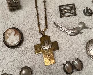 Yep, that’s an early Jeep Collins Descending Dove Cross necklace in Sterling Silver & Brass, and on its original chain!