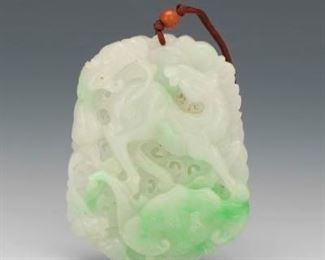 A Carved Jadeite Pendant 