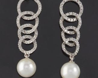 A Pair of Diamond and Pearl Earrings 