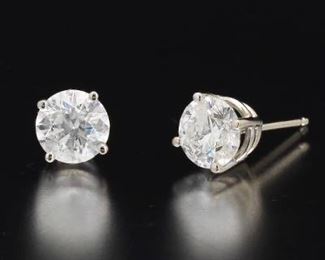 Ladies Pair of Gold and Diamond Solitaire Ear Studs 