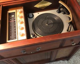 '60s Magnavox Astro high fidelity stereo - turntable, radio tuner, built-in speakers, and record album storage. The turntable and stereo speakers work; the radio tuner does not.