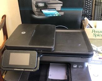 HP Photosmart printer. It copies, prints, faxes, and prints great photos. Works great. We'll even throw in photo paper and extra ink cartridges. 