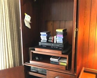 High quality Hooker brand TV/stereo armoire. Doors close to hide tv when not in use; retract fully when watching. Stereo equipment. New VHS tapes. CDs. Even cassette tapes! $50.