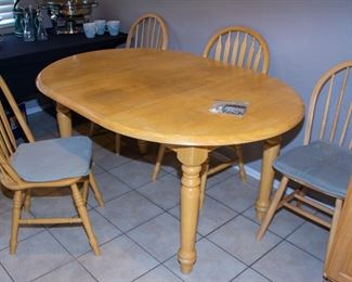 Wooden dining table and chairs (x4)