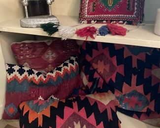 pillows made from old woven rugs and blankets