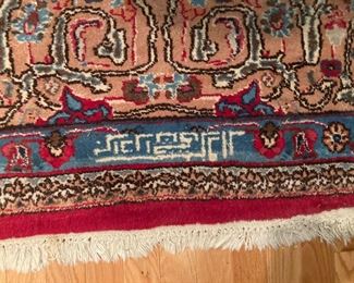 signature of carpet weaver?  on living room rug.