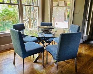 Glass and Chrome Dining Table and 4 chrome legged chairs.  Chairs and table sold separately.