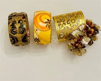 Iris Design bracelets (L) and other bracelets and cuffs