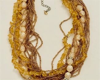 Neutral beaded necklace with multi-sized stones