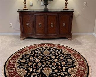 Lower Level:  A handmade 77" round rug was originally purchased at Amini's in Chesterfield.  Closer photos of the cabinet follow.