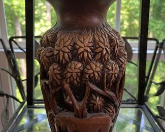 Sun Room:  Here is one of the two individually priced hand carved high-relief wooden vases.