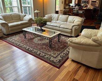 Living Room:  The Italian made neutral color leather furniture by "“Due Linee Salotti" is individually priced.  The sofa is 87" long but the settee is 66" long.  Both have ATTACHED seat and back cushions.    An ottoman is to the left; and oversized chair is on the right.