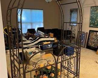Lower Level:  Dress up your gardens with this multi-piece metal gated arbor.  The two-part arch fits in to the sides; the gate attaches to the sides.  It measures 54" wide x 24" deep x 84" tall. The Van Gogh prints have been placed elsewhere, but the other items are not for sale.