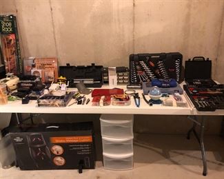 Lower Level-Storage Room:  A great assortment of cameras, a handheld color TV, a walkman, a SHIATSU massage seat for those rough days, a remote car starter as well as an assortment of ratchet/socket sets.
