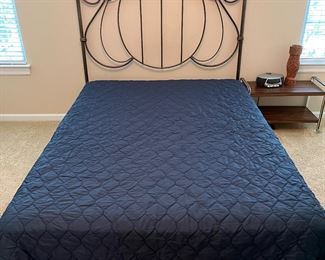 Bedroom #3:  A queen size iron headboard is priced separately from the SERTA queen size mattress and navy comforter.