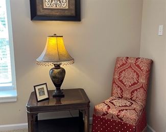 Bedroom #1-Upstairs:  A "crackled verdigris" print with a bronze finish frame coordinates with two other "crackled" prints nearby.  The LANE side table, lamp, and chair are each individually priced. 
