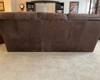 Lower Level: This is a view of the back of the leather sofa.  It is in such great condition that you an "float" it in a room, as shown. 