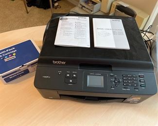 Office Area-Upstairs:  A Brother ink jet printer also has Wi-Fi and faxes, scans, and copies. There are 27 separately priced ink cartridges in black, yellow, cyan, and magenta nearby.