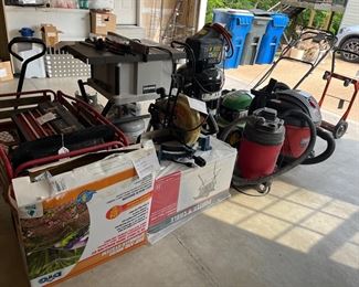 Garage:  More good stuff . . . a RYOBI Compound Miter Saw TS1301; a couple of Shop-Vacs (6 gallon and 16 gallon); and a small hand cart.