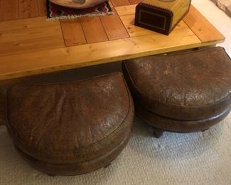 Embossed half moon leather ottomans and large plank table 