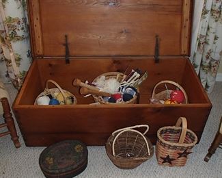 Chest filled with knitting accessories 