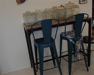 High-top table, two metal blue stools, collection of glass Planters jars 