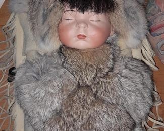 Native American Papoose Baby Cradleboard W/ Hand Painted Porcelain Head W/ Buffalo Fur Hair, Deer Leather, Rabbit Fur, & Glass Beads (Forebears Trading Co.)