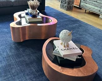 Wave center table made from hammered copper patina table is made of wood and finished manually with hammered copper for the set of two original. Retail price was about 14,000 selling the pair now for $5000.