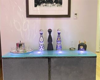 Bar cabinet
Custom made with light up frosted glass countertop, custom pony hair doors, black with trim, silver legs matte finish $1200